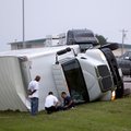 Northbound traffic passes a truck that was blown over during a storm on I-35 near Hillsdale Free Wil...