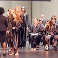 Stephanie Maxwell lines up with other Bentonville High School students Tuesday to receive University...