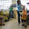 Dennis Woosley, a student at the Bentonville Head Start, opens his birthday present from the Junior ...