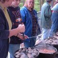 Peg Sturbleng of Rogers, from left, and her 14-year-old daughter, Samantha, check on a stroganoff th...