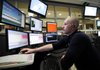 James Templin with the Rogers Police Department dispatches officers Tuesday in Rogers. The department has remodeled and upgraded its communication center for emergency services.