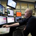 James Templin with the Rogers Police Department dispatches officers Tuesday in Rogers. The departmen...