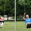 Emily Mason, 2, takes a ride on a swing with her dad, Joseph Mason of Fayetteville, at North Shore P...