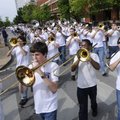 The Fayetteville High School Bulldog Marching Band makes their way around the downtown square Wednes...
