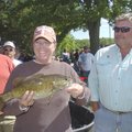 Tammy Duncan of Lowell beams over a 3.1-pound smallmouth bass she and her husband, Eugene Duncan, ca...
