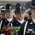 Cpl. Jason Renfrow, center, waits Wednesday with members of Springdale Police Department’s Honor Gua...