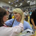  Madeline Whitaker, a Fayetteville High School graduating senior, hugs teacher Becky Williams on Thu...