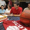  Greenland’s Elijah Wolfe, center, signs a national letter of intent to play basketball for Lyon Col...