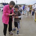 Rhonda Moore, principal at Root Elementary School in Fayetteville helps a student call a parent aft...