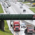 Traffic backs up moving northbound on Thompson in Springdale as water floods the dip in the road due...