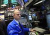 Bank of America specialist Mark Fitzgerald works at the New York Stock Exchange on Friday in New York.