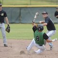 Bentonville sophomore second baseman Ryan Harralston, right, makes the relay throw to first after fo...