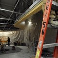 Contractors work on the new deli area Tuesday at Walmart Neighborhood Market in Bentonville.