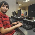 Karan Batra, a senior at Bentonville High School, photographed in one of the school’s computer labs....
