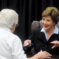 HEARTFELT GREETING - Former first lady Laura Bush signs copies of her book, “Spoken from the Heart,”...