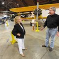 Warren Jones, director of the Arkansas Air Museum, speaks with event chairwoman Nancy Young on Tuesd...