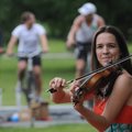 Kari Bethke of New York plays the violin Sunday with Rana Santacruz during the Trail Mix Concert Tou...