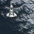 FILE — The space shuttle Atlantis flies over a mountainous region of Earth before docking at the int...