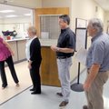 A line of early voters begins to form again after lunchtime Monday outside the doors of the Benton C...