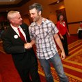 Steve Womack talks to Jonathan Story before he played piano at Womack's watch party on election nigh...