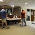 Poll supervisor Roger Schoolcraft, right, oversees the St. John's Lutheran Church in Fayetteville on...