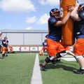 Rogers Heritage’s Jeff Phillips, right, and Max Hotelling, work on blocking drills during Monday’s p...