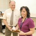 Kirksey Middle School teacher Cathy Julius accepts the Rogers-Lowell Chamber of Commerce’s Middle Sc...