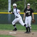 Shiloh Christian’s Chris Oliver rounds second base as De Queen’s Sam Willis looks in shock at an ove...