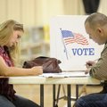 Kevin and Melissa Guthrie of Fayetteville, cast their ballot Tuesday afternoon at the Yvonne Richard...