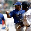 Tulsa shortstop Daniel Mayora checks the runner on third base, while Northwest Arkansas’ Derrick Rob...
