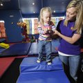 Christie Summerford, a physical therapist for Children’s Therapy T.E.A.M. in Fayetteville works with...