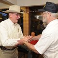Benton County Sheriff Keith Ferguson, left, shakes hands with Ray Pennock as Pennock leaves a watch ...