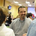 Kelley Cradduck, center, talks with supporters Charlie Holyfield, right, and Holly Holyfield at an e...
