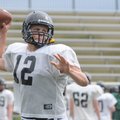 Bentonville’s Pearson Gean throws a pass Wednesday during spring practice in Tiger Stadium.