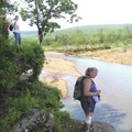 Tracy Fortuny of Rogers, left, and Debbie Van Blaricom of Springdale admire the view of Frog Bayou w...