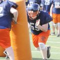 Rogers Heritage’s Jacob Huckaby runs drills during practice Monday in Rogers.