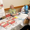 AUTHORS SHOWCASE - Jo Ann Snapp, right, an author, talks Friday with Frankie Carlin Meyer about her ...