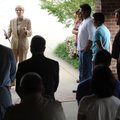 PRAYER VIGIL - Bentonville attorney Susie L. Hoeller, left, speaks to a group assembled Thursday at ...