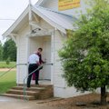 Church members Ruth and Wayne Sharp enter Miller Community Church for service on Sunday. The once-ru...