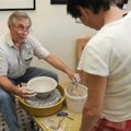 VESSEL OF CREATION - Jim Young forms a piece of clay into a vessel Friday during a demonstration at ...