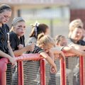 Bentonville’s Meghan Green, left, and her teammates react to a seventh-inning, two-run home run by B...