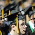 Austin Branam listens Saturday to a speaker during the Bentonville High School Class of 2010 commenc...