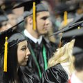 Presley Covington listens Saturday to a speaker during the Bentonville High School Class of 2010 com...