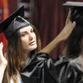 Jennifer Todd, left, and Myrissa Ellis help each other fix their graduation cap Saturday before the ...