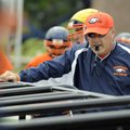  Rogers Heritage head coach Perry Escalante watches linemen run through chute drills during spring p...