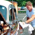 Eric Shaffer, of Fayetteville, shines up his father’s all original 1953 Chevrolet Bel Air at the Bik...