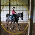 Zackery Simek rides Bandit through the obstacle course during the Horses for Healing Special Olympic...
