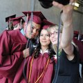 Kristen Novotny, right, takes a photo of students Jesús Paredes, left, and Jahzeel Olvera on Saturda...