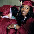 Jewel Tabron looks up Saturday after hugging a friend while waiting in line before the start of the ...