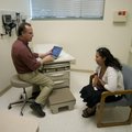 APN Randy Naeger talks May 17 to Martha Gomez in one of the new exam rooms at the Community Clinic i...